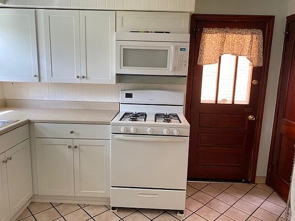 Updated kitchen with new range and microwave