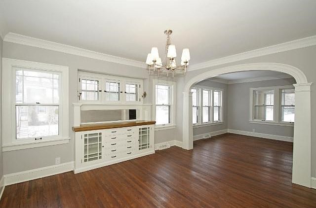 Formal dining room with built in buffet and and archway that leads you into the room.
