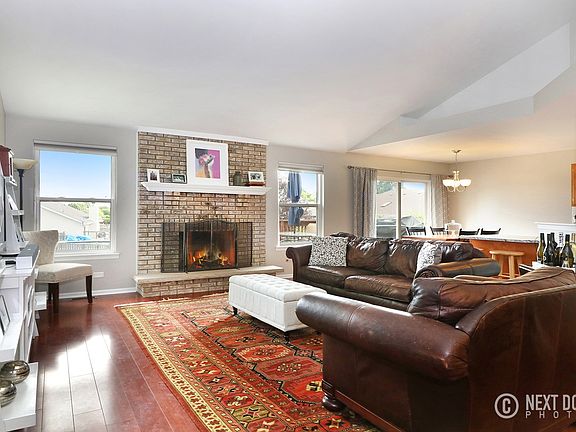 Gorgeous, light filled, open concept space with wood burning fireplace.