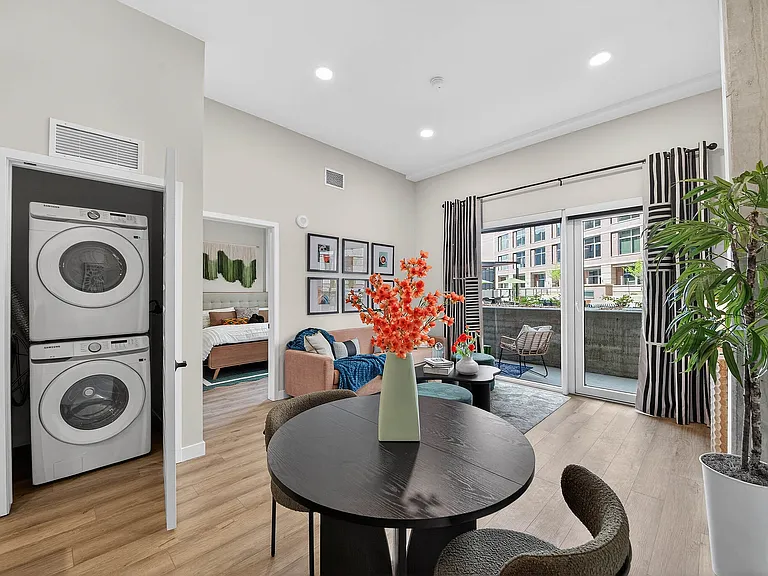 Living and kitchen area with stainless steel appliances