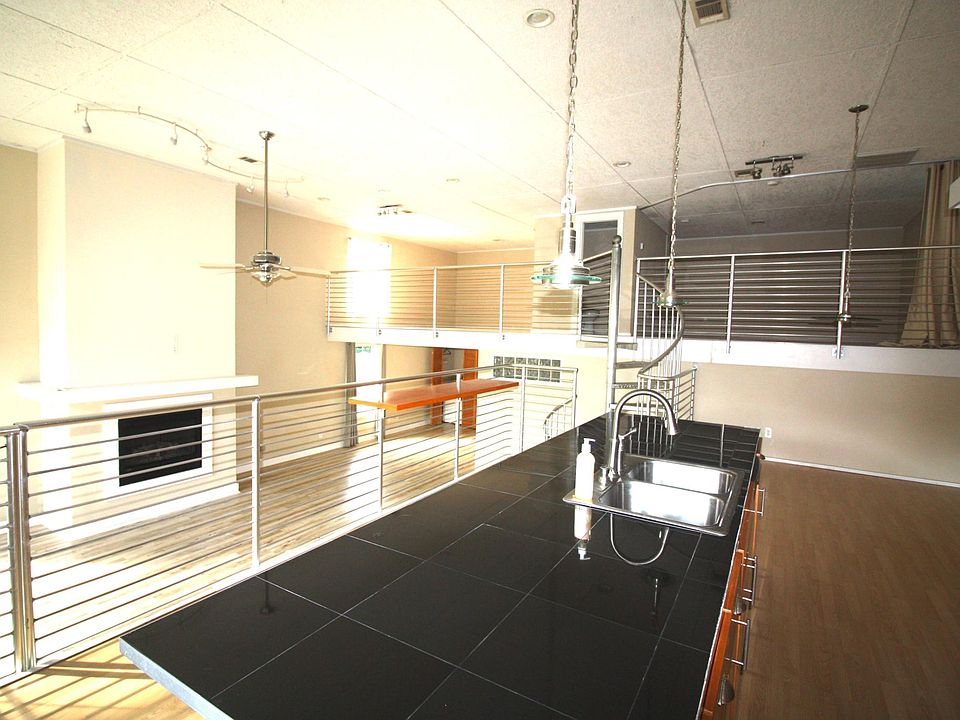 View from kitchen overlooking the living room and upstairs loft areas.