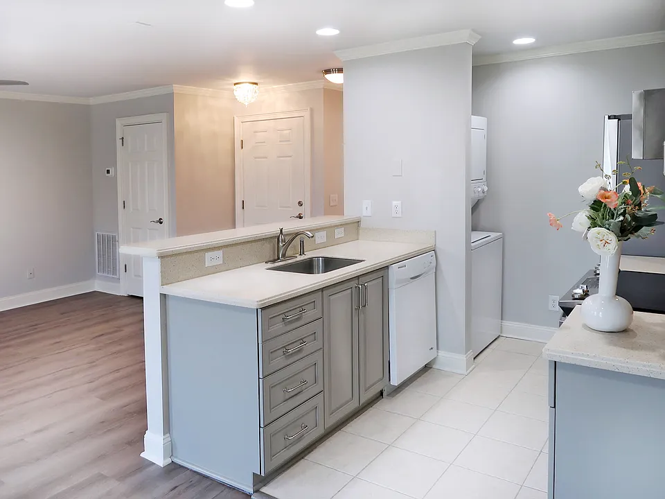 The Kitchenette offers a French Door Samsung Fridge, Frigidaire Gallery Microwave, GE Glass Cooktop Range, Dishwasher and stacked Washer/Dryer.