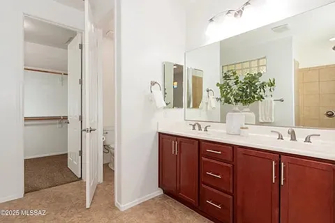 Master Bath to large His/Hers closet