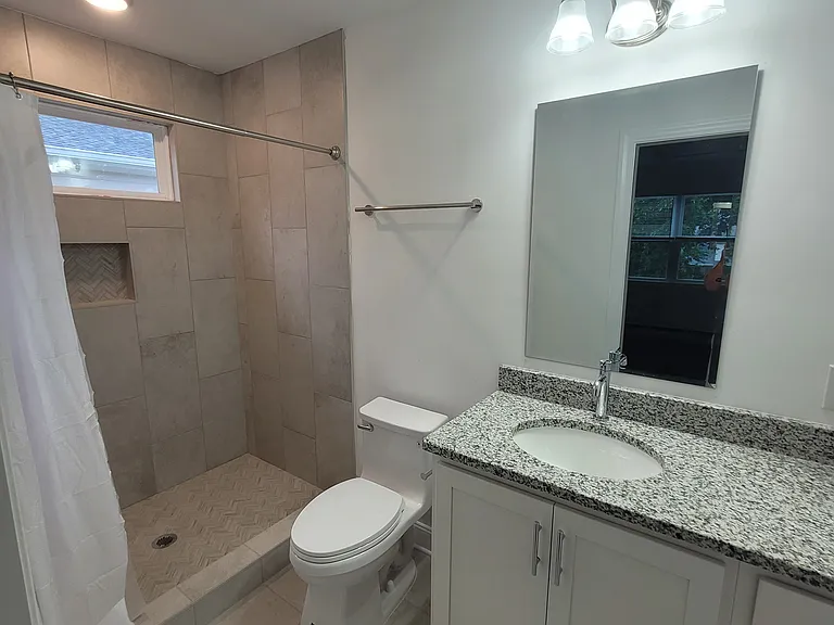 Granite countertops in each bathroom and large shower