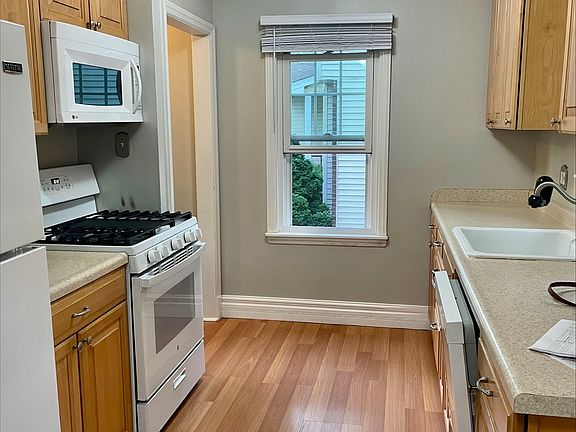 Renovated kitchen with newer appliances.. includes a dishwasher and a microwave!