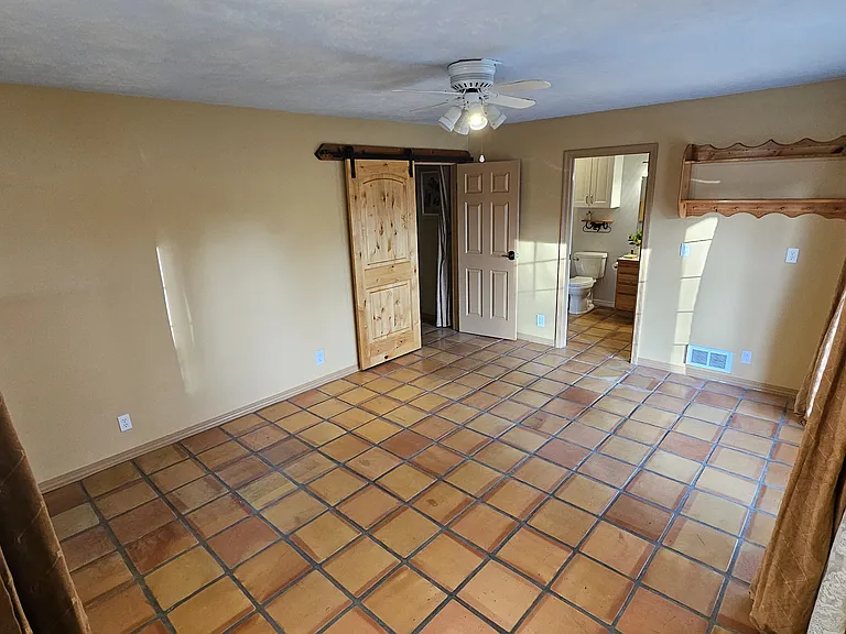 Master bedroom looking to private bathroom