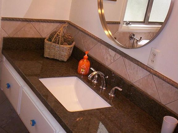 Custom Desinged Bathroom wtih Floating Granite Vanity Counte