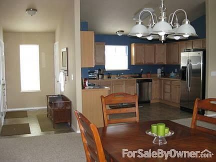 Foyer and Dining Room w/ vaulted celing