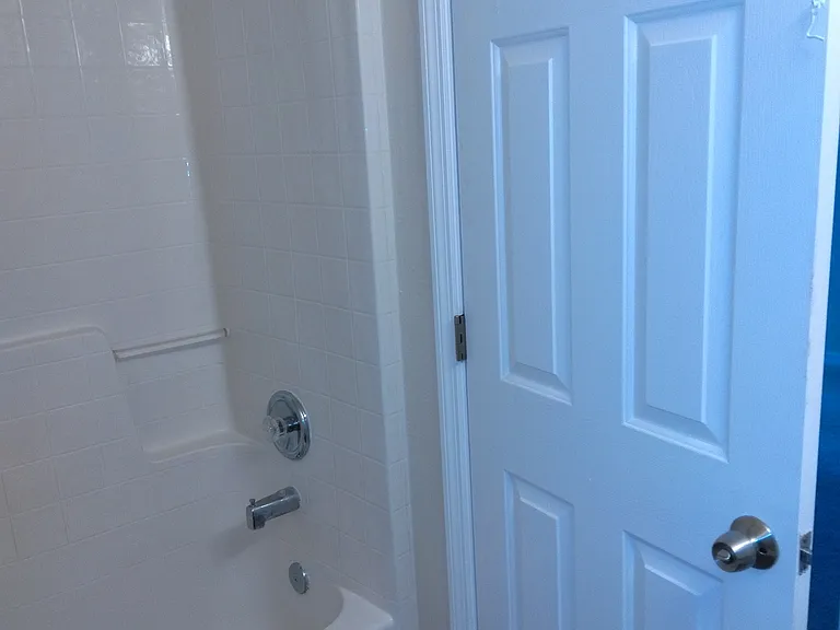 Shower bathtub combo in master bedroom.