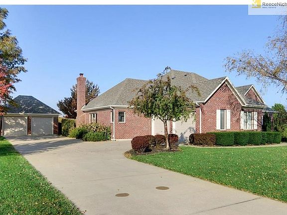 Two-car side entry garage plus detached, heated 2-car garage.