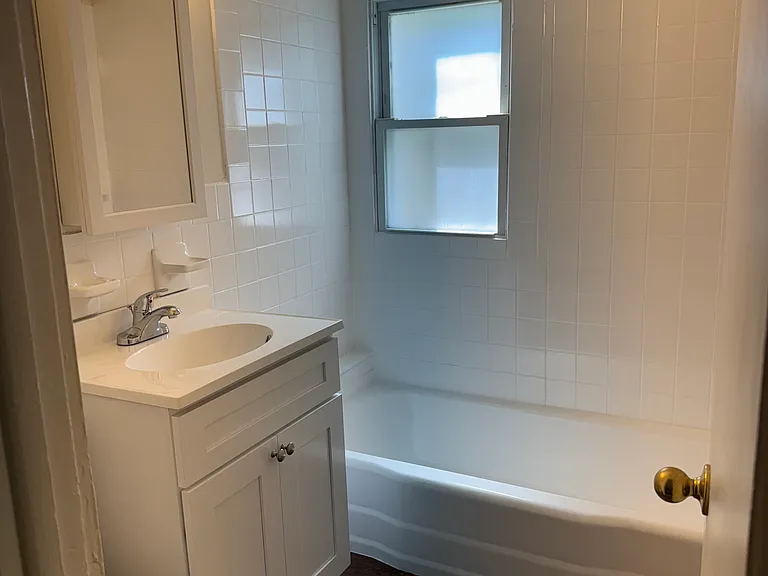 Upstairs full bath with new vanity and medicine cabinet.