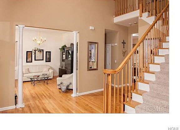 The first floor boasts gleaming hardwood floors and 10 foot ceilings.