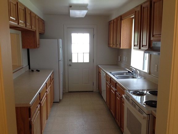 Galley Kitchen with Bar to Dining Room