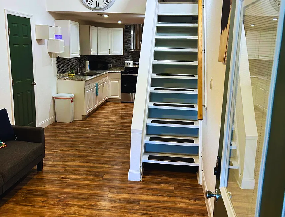 Bright open layout with a fully equipped kitchen and cozy living space.