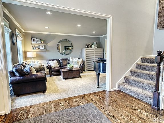 Elegantly updated home with refinished hardwood floors and wainscoting in Formal Living Room
