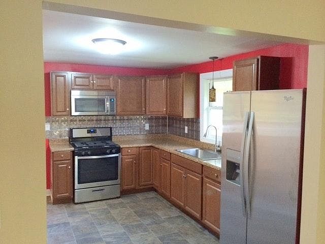 Brand new kitchen featuring stainless steel appliances, new