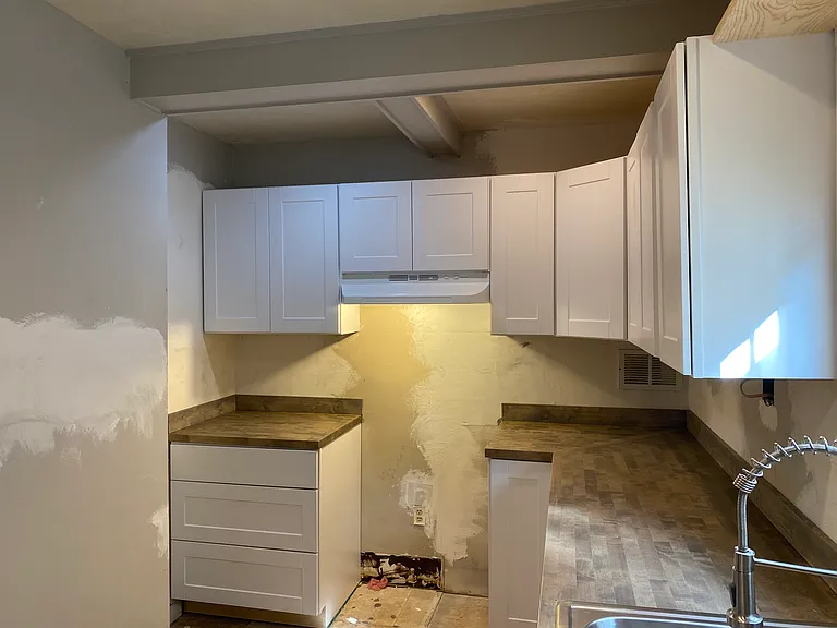 Another view of kitchen with new cabinets and counters.
