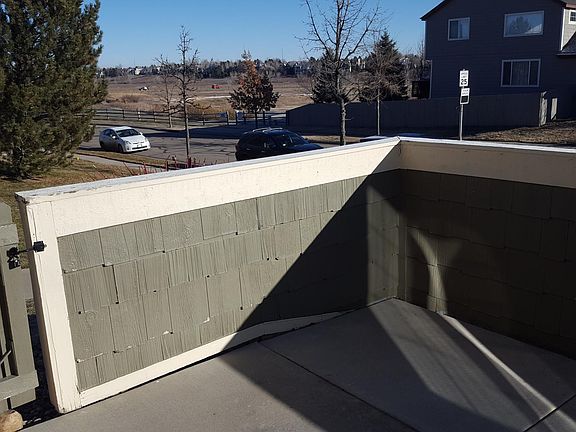 Large, Fenced Patio looking out onto green space and biking/walking trails