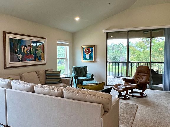 Living room with three panel sliding glass door