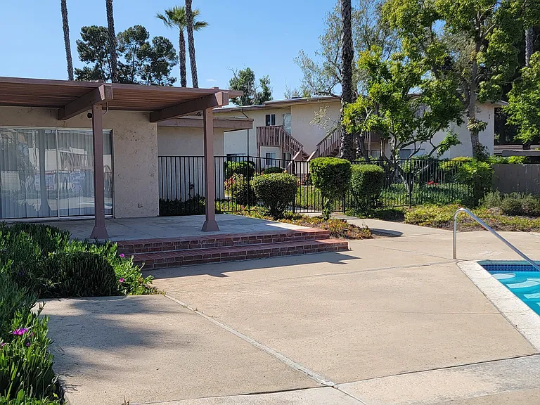 Club house next to swimming pool at Plaza Verde Apartments in Escondido, California.