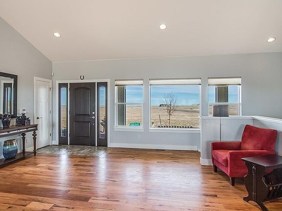 View of Covered Entry, Flex Space and Basement Staircase