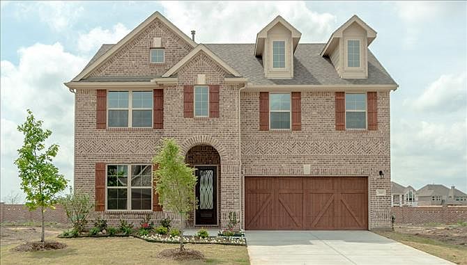 Galveston exterior with cedar garage doors