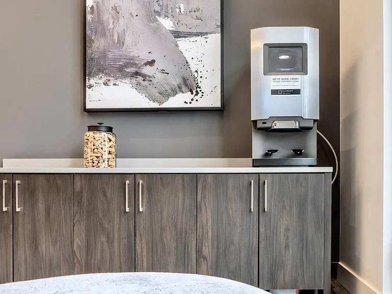 Common Area Featuring Refreshment Station and Storage Cabinets