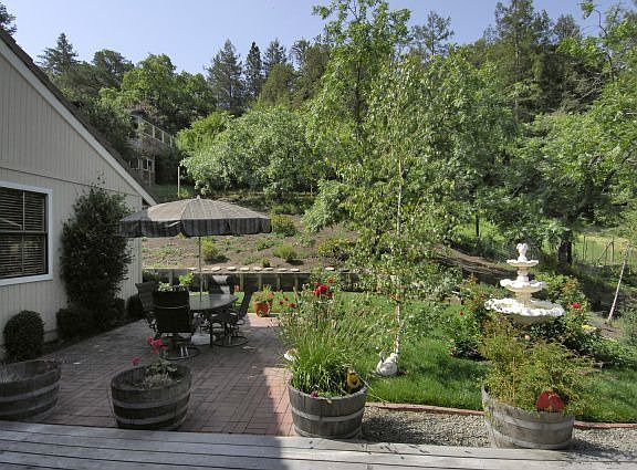 Wooded views from landscaped yard and gardens