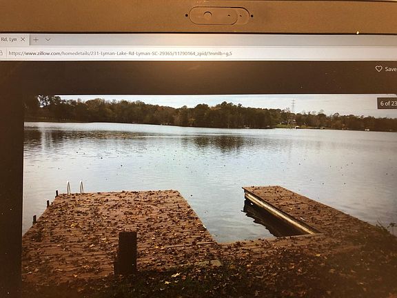 Boat slip and dock. Swimming ladder and walk-down steps with handrail on property (not shown).