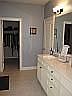 Master bath with view of large "Her" closet.