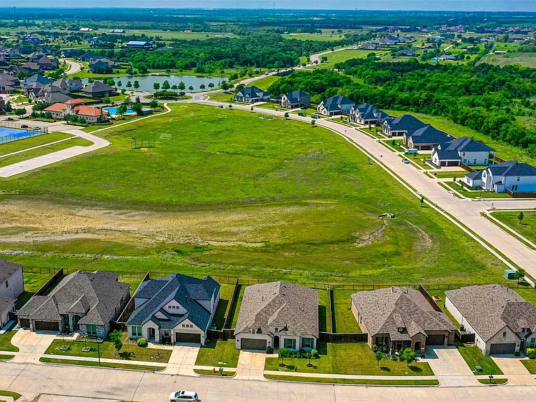 Aerial perspective showcasing a residential community with diverse single-family homes
