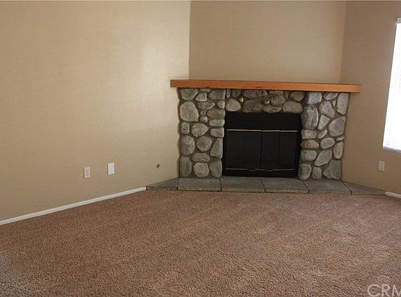 Inviting fireplace in living room.
