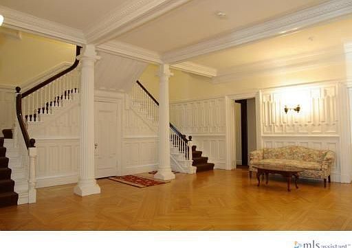 Grand entry with double staircase in this old Back Bay mansion