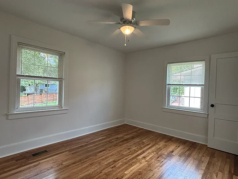 Bedroom 1 (140 sq. ft.) ceiling fan, 2 windows, closet.