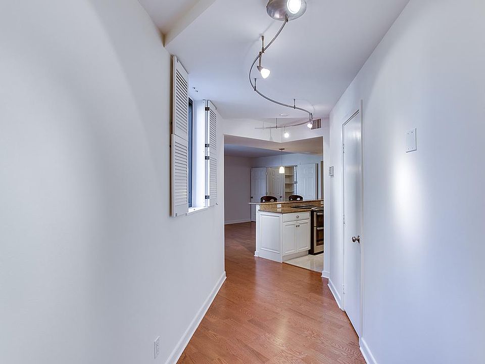 Hallway entry with track lighting (brand new LED fixtures throughout)