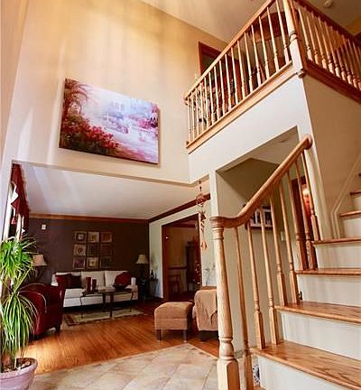 A welcoming two story entry that is spacious and filled with natural light.