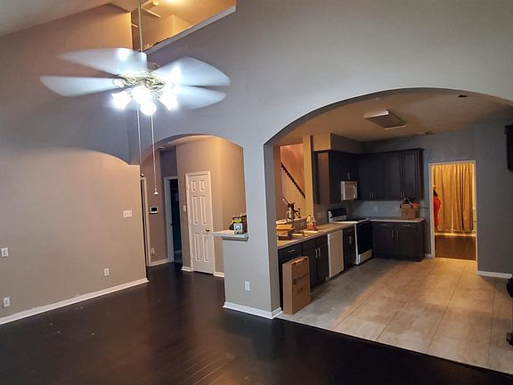 View of living room and kitching, high ceilings!!