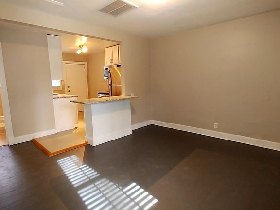 View from living room into kitchen and bathroom