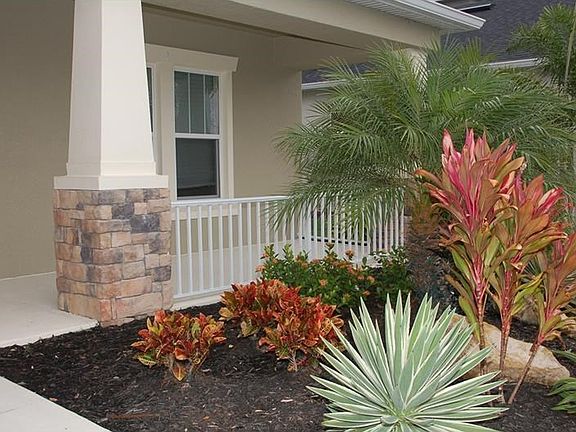 Kentwood III Front Porch View with Stunning Landscaping