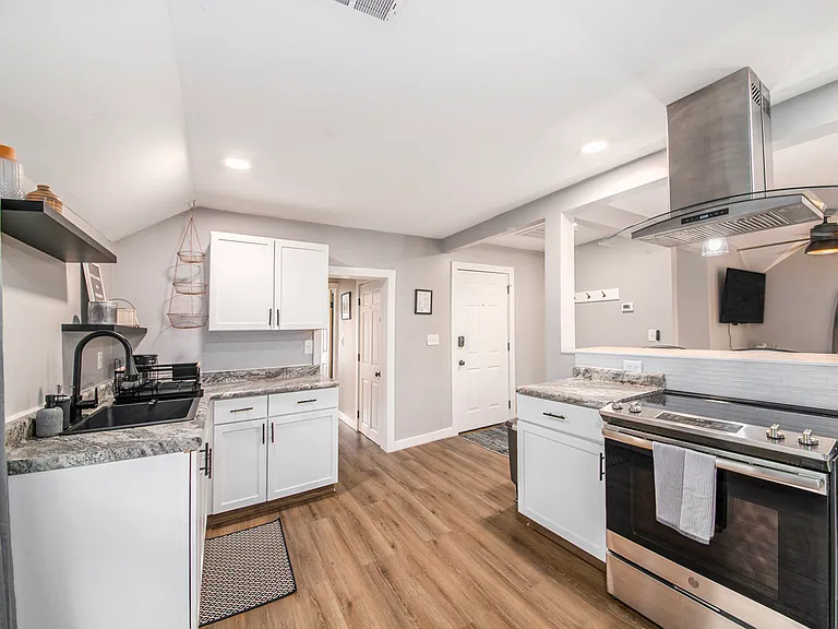 Full range and oven, with overhead exhaust fan, OPEN CONCEPT kitchen/living room area