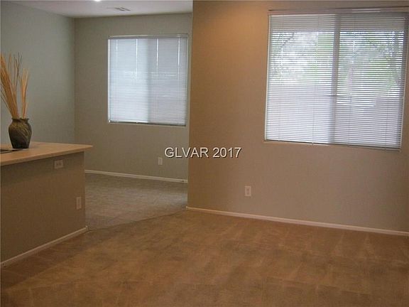 The dining area leads to a cozy covered patio which is convenient and perfect for barbecues 365 days
