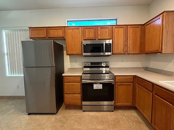 Kitchen. New refrigerator, microwave, and stove.