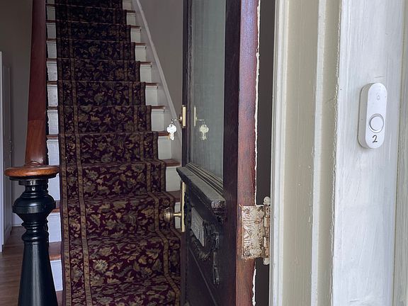 Front entryway to second floor apartment. Private entryway in rear of home