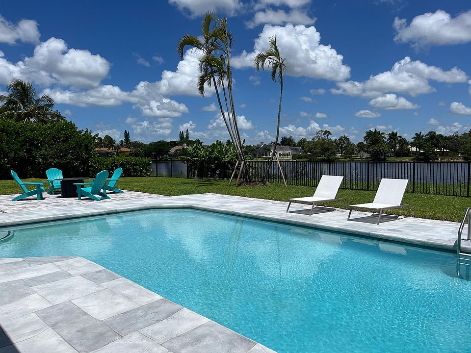 Newly refinished pool area overlooking the lake, at The Palm View House