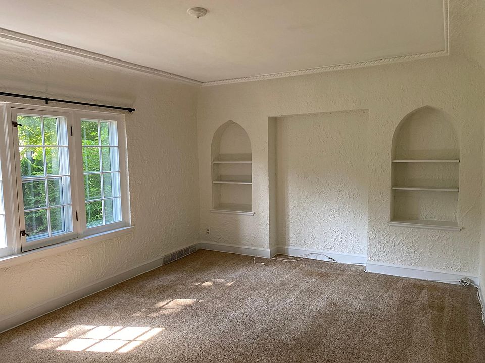 Sunny living room with built-ins
