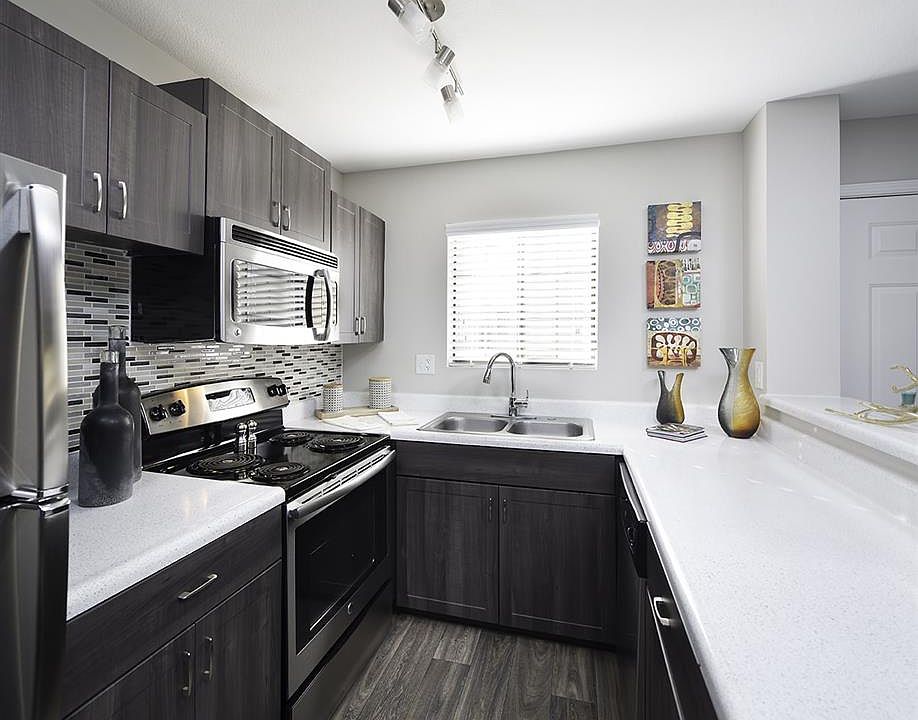 Newly updated kitchens include stainless steel appliances an