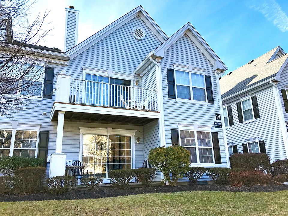 Front of building (unit is on ground floor with patio)