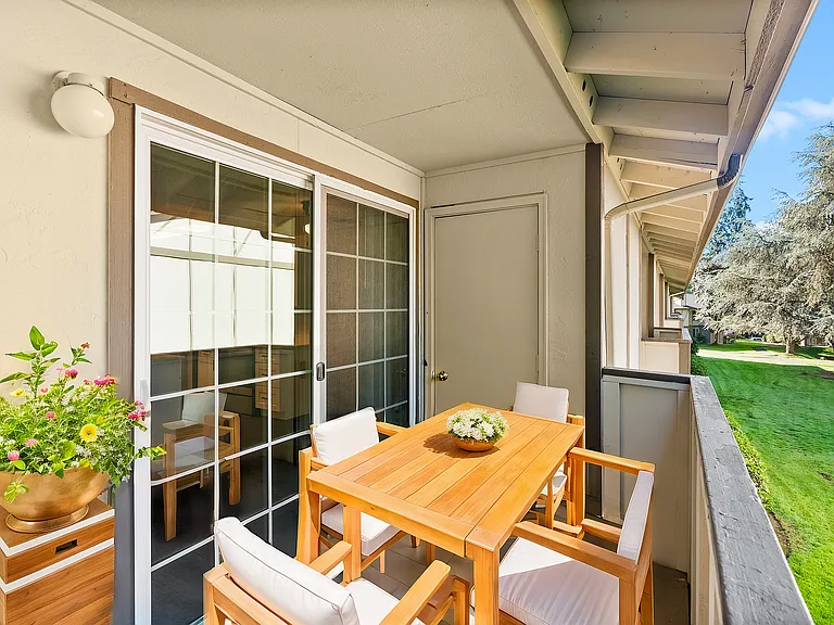 Enjoy serene outdoor moments on this charming balcony, perfect for relaxation. Enjoy serene outdoor moments on this charming balcony, perfect for relaxation.
