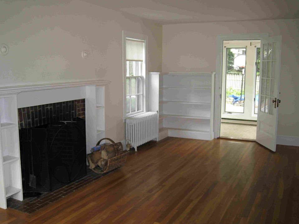 Living Rm w/ fireplace opening to rear sun room