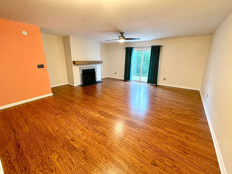 Combo dining and living room with fireplace. Walk-out to large trex deck